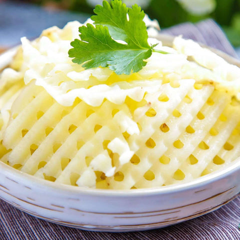 Two-pack stainless steel crinkle cutter set for potatoes; close-up of wavy-cut potato slices with parsley garnish