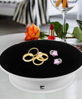 Cool Electric Rotating Display Stand With Adjustable Motorized Turntable Perfect For Jewelry Watches And Collectibles Featuring Anti-Skid Base Energy Saving Design Ideal For Photo Shoots Store Exhibitions with rings and earrings.