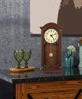 Wooden wall clock with gold pendulum on marble countertop, part of Metal Pendulum Clock Replacement Part, 5.90 Inch Wall Clock Accessory.