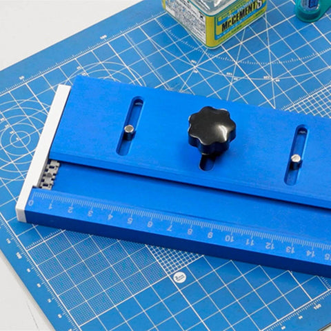 RC Tank Track Link Assembly Jig For Easy Track Link Installation, Portable Chain Wheel Tool on blue cutting mat