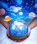 Kids Space Projector Night Light With 360 Degree Rotation And Five Projection Films displaying cosmic stars and planets.