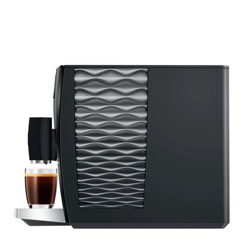 Top Tier Automatic Coffee Maker In Sleek Piano Black With One Touch Brewing For Barista Style Espresso And Creamy Latte Blends Made Daily Without The Sweat, showcasing sleek side design and brewed espresso.