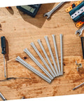 Durable 10 Piece Spring Tubing Bender Set For Plumbing And Electrical Projects on a wooden work table.