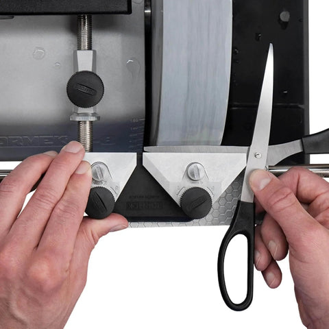 Hands using Pro-Grade Scissors Sharpening Jig With 60 Degree Angle For Fast, Precise Sharpening On Your Sharpening System