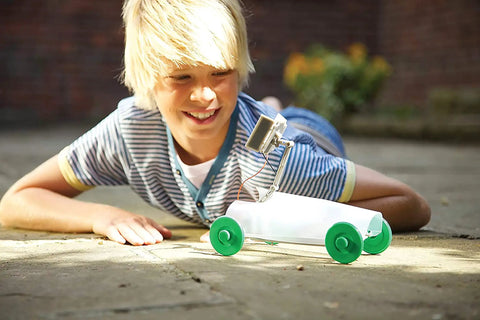 Green Solar Rover Kit For Kids DIY STEAM Science Project To Build Your Own Solar Powered Rover From A Recycled Can Ages Five And Up Hands On Learning Toy For Boys And Girls, boy beside can rover