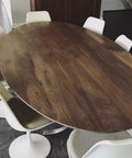 Top Shelf Rustic Walnut Oxidizing Wood Stain Delivers A Slick Aged Look With Natty Tannin Reactions For Dope Diy Restorations And Hella Authentic Furniture Upgrades on an oval walnut dining table with white chairs.