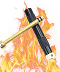 Compact Air Compression Fire Starter With Durable Metal Body for camping with brass and aluminum parts against flame backdrop.