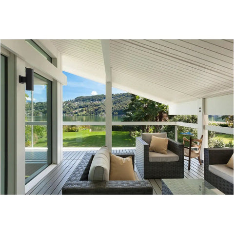 Dope Modern 5 Inch Outdoor Up And Down Wall Lantern In Black Finish on patio with view of mountains and glass railing.