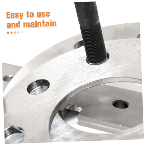Close-up of hydraulic punch driver kit knockout tool with die, showcasing clean hole punching in metal sheet.