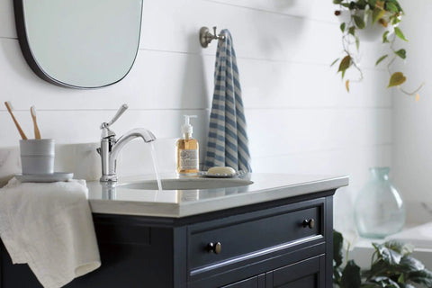 Modern bathroom with Elmhurst No Fuss Single Handle Bath Faucet Chrome Finish For 1 Or 3 Hole 4 Inch Install with soap dispenser.