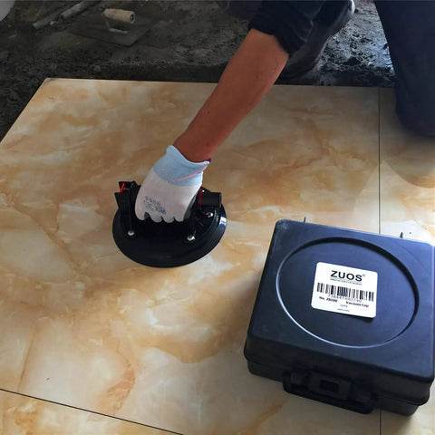 8-Inch Glass Vacuum Lifter Handheld With Handle, Workhorse Heavy Duty Industrial Lifter For Glass, Granite, Windows And More, Lifts Up To 520 Lbs, Includes Carrying Case shown lifting a tile with carrying case nearby.
