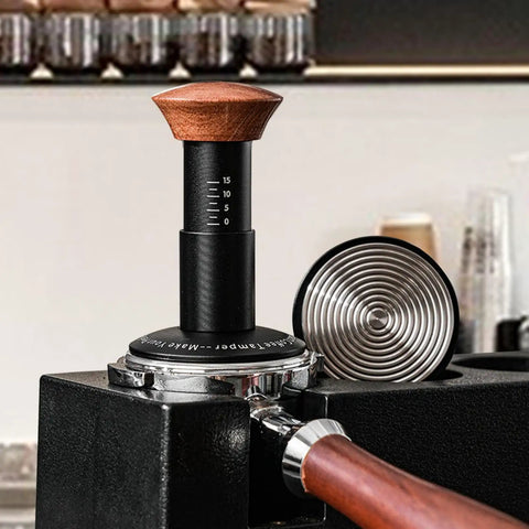 Heavy Hitter Spring Loaded Coffee Tamper With Precision Distribution Leveler And Clear Pressure Scale for espresso puck preparation.