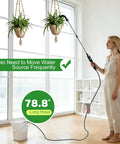 Person using High Reach Plant Waterer With Type C Wireless Wand, Battery Powered Sprayer to water hanging plants.