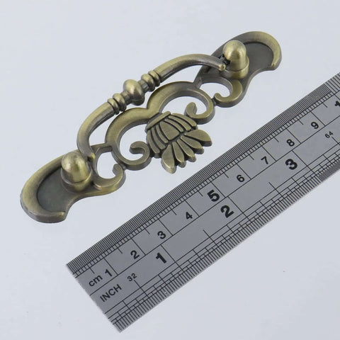 Six Pack Bail Pull Handles For Cabinets, 3.89 Inch Total Length, Zinc Alloy Drawer Pulls with antique bronze design next to ruler
