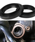 Heavy Duty Front Differential Carrier Seal and CV Axle Shaft Oil Seal Kit for 4Runner Tacoma Sequoia Tundra Fj Cruiser Lexus GX LX Vehicles 2 Pack leak fix with seals and installation view.