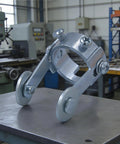 Exclusive roller guide for 66 Piece Plasma Cutter Consumables Kit For PT 31 JG 40 LG 40 Torches on metal table in workshop.
