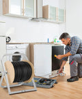 Industrial Steel Cable Reel Holder Heavy Duty Spool Rack Dispenser in use during appliance repair