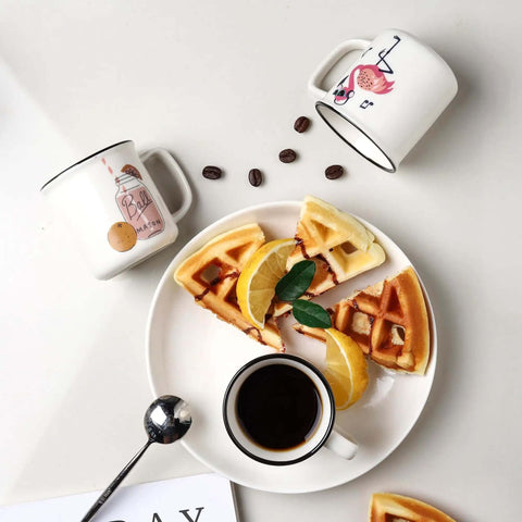 Overhead view of breakfast setting with espresso, waffles, lemons, and two Four Pack Ceramic Demitasse Espresso Cups, 4.23 Oz Small Coffee Mugs For Espresso Machines And Home Coffee Makers visible.