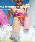 Outdoor Portable Bluetooth Boombox Speaker Waterproof, True 16W Power Sound With 100 Ft Bluetooth 5.3 Range, Crisp Highs And Punchy Bass, Ideal Gift For Women Moms Wives Pink, shown poolside with water splashes.