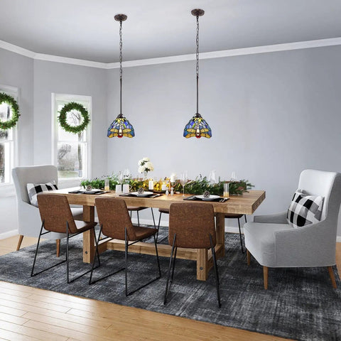 Dining room with Sunniva Dragonfly Tiffany-Style 1 Light Mini Pendants, 8 inch wide, hanging above table, handcrafted glass shades.
