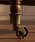 Vintage Furniture Caster Cups Featuring Slick Swivel Replacement Wheels Heavy Duty Dark Brown Metal Frame No Fuss Floor Savers For Sofas And Tables Smooth No Sweat Quick Swap Upgrade, close-up of caster cup and wheel.