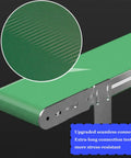 Close-up of Rock Solid Mini Desktop Conveyor Belt With Slick Pvc Track showing green anti-static surface and upgraded connection teeth.