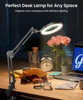 Hands Free Desk Magnifier With Light And Clamp, 10X Real Glass Lens illuminating workspace with flowers and laptop.