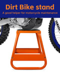 Heavy Duty Center Stand For Dirt Bikes And Powersports With Non Slip Pad, orange color, beneath a dirt bike