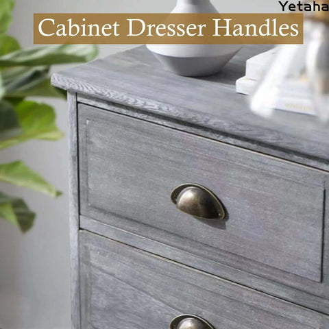 Old School Cool Vintage Brass Cup Knobs With Yellow Bronze Antique Finish For Dresser And Cabinet Drawer Upgrade Straight Up Heavy Duty Zinc Alloy Handles With 65 Millimeter Screw Spacing And Screws Included on a gray dresser.