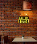 Funny Dope Caution Overhead Equipment Metal Sign 8x12 Inch Aluminum Wall Decor in a cozy brick-walled room
