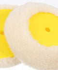 Close-up of the double ended paint roller corner tool's plush pad with yellow base for effective wall painting.