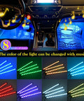Multicolor Music LED Car Interior Strip Lights Kit With Sound Active Rhythm USB Powered Under Dash Ambient Lighting Wireless Remote Control 4 Piece Set Easy Install 2 Year Warranty showing blue lighting inside a car