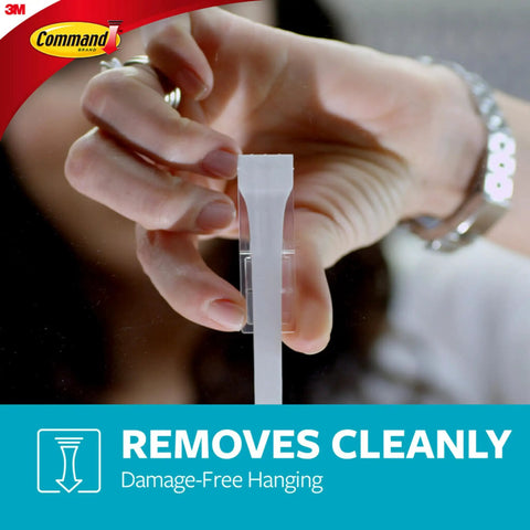 Person removing a Replacement Bath Strips Set With 2 Medium And 4 Large Water Resistant Adhesive Strips For Rehanging Bath Hooks Or Caddies No Tools No Residue Easy Removable In Hot Wet Humid Bathrooms from glass surface.