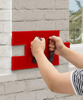Hands holding Red Concrete Stamp Mat 17.9x7.8 Stone Texture PU Mold For Stamped Concrete Patio And Driveway on wall