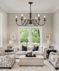 Living room with Six Light Black Farmhouse Chandelier With Rustic Industrial Iron Build Modern Metal Candle Style Ceiling Light For Living Room Dining Room Kitchen Island And Bedroom Vibe Upgrade.