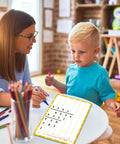 Teacher and child using 12 Pack Double Sided Whiteboards 9x12 Inches For Math Practice Long Division Dry Erase Lapboards at table