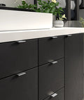 Lincoln Collection 1 5 16 Inch Center To Center Stainless Steel Modern Cabinet And Drawer Edge Pull Handle installed on dark cabinet.