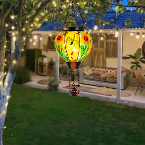 Hot Air Balloon Solar Lantern for Outdoor Use, dragonfly inspired glass hanging light in garden, warm glow at night