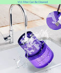 Washing a purple V11 Torque Drive Replacement Vacuum Filter under a faucet with cleaning brush shown, Part No 970013 02.