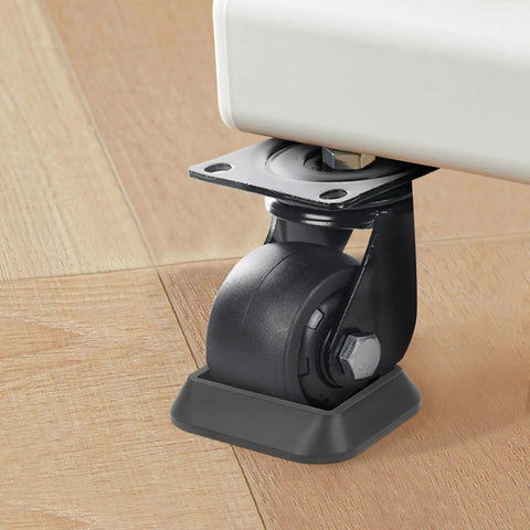 Close-up of Furniture Stoppers And Wheel Caster Cups Silicone Non Slip Pads under a chair wheel to protect floors, 8 pack everyday use.