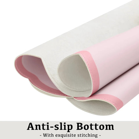 Side view of Oversized Pink Scalloped Desk Pad For Keyboard And Mouse, 31.5 Inch By 15.7 Inch PU Leather Mouse Mat With Waterproof Checkered Pattern.
