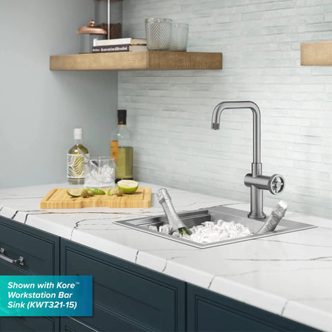 Urbix Industrial Single-Handle Bar Kitchen Faucet in Brushed Gold with Diamond Textured Accents over a marble countertop