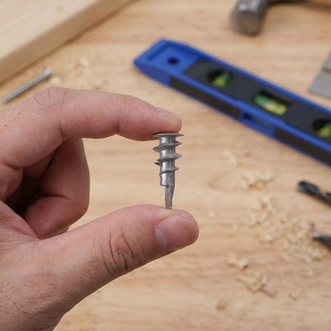 Heavy Duty Drywall Anchors And Self Drilling Screws Kit With Reinforced Support That Keeps Sheetrock From Cracking For Home Renovation And Shelf Mounting Includes 30 Zinc Anchor Sets For Fast Solid Installations., self drilling zinc drywall anchor held between fingers