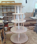 Woodshop with No Fuss Ellipse Router Circle Cutting Jig For Woodworking parts staged for project assembly.