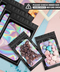 Black Mylar Holographic Bags 100 Pieces Resealable Foil Pouches For Food Storage Lip Gloss Jewelry Eyelash Packaging For Small Business Size 2.4 By 3.9 Inches with coffee beans and candies inside.
