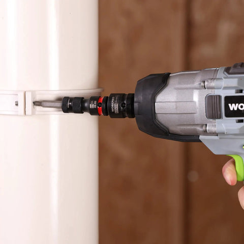 Three-Eighths To One-Fourth Inch Quick Release Impact Socket Adapter And Bit Holder For Ratchets Wrenches Drills And Drivers Built Tough From Durable CR-MO Steel being used with a drill to attach a fixture to a pipe