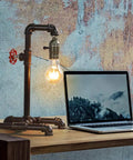 Old School Industrial Steam Punk Table Lamp With Red Valve, rustic bronze pipe desk light near laptop on wooden table