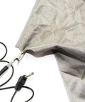 Black 20 ft grounding cable with alligator clip and plug on silver EMF-protection fabric