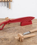 Rock Solid Table Saw Push Stick With Riving Knife Splitter 16.5 Inches Long anti kickback tool on wooden surface.