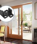 Black Sliding Barn Door Floor Guides made from durable POM plastic for bypass, pocket, closet, and barn doors, installed view.